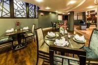 a dining room with a table and chairs at Crowne Plaza Liverpool - John Lennon Airport by IHG in Liverpool