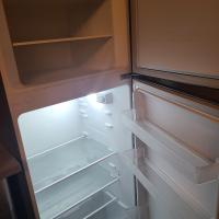 an empty refrigerator with its door open and its shelves at Appartement T2 Brest Pilier Rouge avec internet in Brest