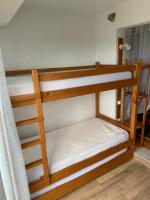 a couple of bunk beds in a room at L appartement de la plage in Le Barcarès