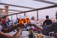 a group of people holding up glasses of wine at Hilton Molino Stucky Venice in Venice