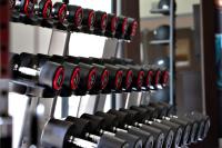 a bunch of wine bottles lined up in a rack at Hampton By Hilton Toulouse Airport in Blagnac