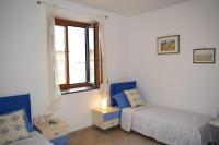 A bed or beds in a room at Casa Tonia