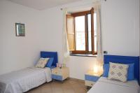 A bed or beds in a room at Casa Tonia