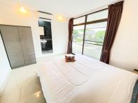 Postel nebo postele na pokoji v ubytování KOUAC VILLA - PATTAYA HOLIDAY HOUSE WALKING STREET 3 bedrooms