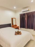 Postel nebo postele na pokoji v ubytování KOUAC VILLA - PATTAYA HOLIDAY HOUSE WALKING STREET 3 bedrooms