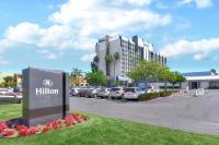a hilton sign in front of a parking lot at Hilton Irvine/Orange County Airport in Irvine