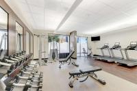 a gym with a lot of treadmills and machines at Hilton Irvine/Orange County Airport in Irvine