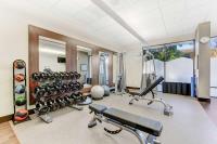 a fitness room with a gym with exercise equipment at Hilton Irvine/Orange County Airport in Irvine