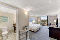 a hotel room with a bed and a bathroom at Hilton Irvine/Orange County Airport in Irvine