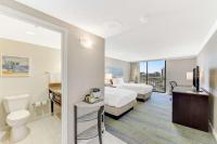 a hotel room with two beds and a bathroom at Hilton Irvine/Orange County Airport in Irvine