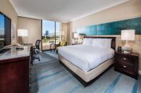 a hotel room with a large bed and a television at Hilton Irvine/Orange County Airport in Irvine