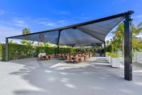 a large canopy with tables and chairs under it at Hilton Irvine/Orange County Airport in Irvine