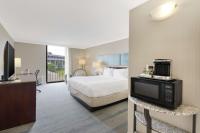 a hotel room with a bed and a television at Hilton Irvine/Orange County Airport in Irvine