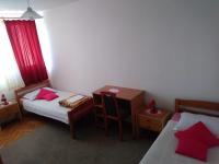 Łóżko lub łóżka w pokoju w obiekcie Marie