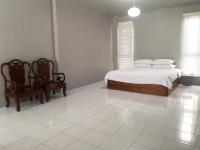Postel nebo postele na pokoji v ubytování Siri Guesthouse @ Surat Thani