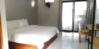 Postel nebo postele na pokoji v ubytování Siri Guesthouse @ Surat Thani