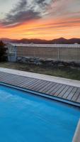 a view of a swimming pool at sunset at Villa Playa del Sol -B4 in Saint-Tropez