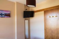 Televízia a/alebo spoločenská miestnosť v ubytovaní APARTAMENTO FAMILIAR Sierra DELUXE