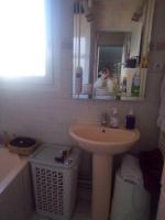 a bathroom with a sink and a mirror and a tub at Appartement T2 lumineux CHU Stade Gaston Gérard 2 nuits minimum in Dijon
