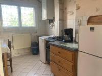 a kitchen with a white refrigerator and a sink at Appartement T2 lumineux CHU Stade Gaston Gérard 2 nuits minimum in Dijon