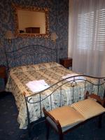 A bed or beds in a room at Hotel Parco Fiera