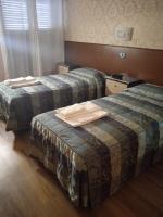A bed or beds in a room at Hotel Parco Fiera