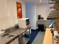 A kitchen or kitchenette at Glads Apartment