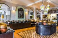 a restaurant with a counter with pots and pans at Sheraton Samui Resort in Chaweng Noi Beach
