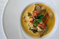 a white bowl of soup on a white plate at Sheraton Samui Resort in Chaweng Noi Beach