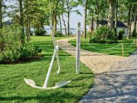 a statue of two olympic skis in a park at Silver Sands Motel & Beach Bungalows in Greenport