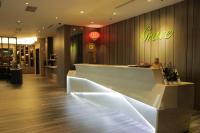 a lobby of a store with a white counter at Grace Hotel in Zhonghe