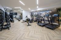a gym with treadmills ellipticals and tread machines at Courtyard by Marriott Paris Porte de Versailles in Issy-les-Moulineaux