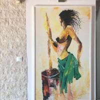 a painting of a woman in a green dress at Penthouse 120 m2 vue imprenable Lattes in Lattes