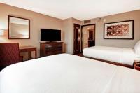 Ein Bett oder Betten in einem Zimmer der Unterkunft Embassy Suites by Hilton Dulles Airport