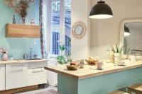 a kitchen with a table with a bowl of fruit on it at Le Boudoir Vieux Lyon-Fourviere 4 pers in Lyon