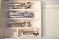 a refrigerator filled with silver utensils at Charmant cocon lyonnais Sathonay-Terreaux in Lyon