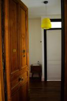 a room with a door and a yellow light at Chez Julie -métro Garibaldi- Université in Lyon