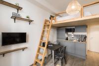 a room with a dining table and a loft bed at Joli 2 pers- Croix Rousse-Chartreux in Lyon