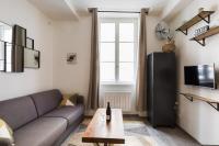 a living room with a couch and a table at Joli 2 pers- Croix Rousse-Chartreux in Lyon