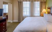 a hotel room with a large bed and a television at Hampton Inn & Suites Birmingham-Downtown-Tutwiler in Birmingham