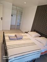 a bedroom with two beds with pillows on them at CHEZ LALLA in Marseille