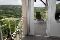 Un balc&oacute;n o terraza en Villa Grenade (haut) - Vue mer et Fort-De-France