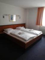 Postel nebo postele na pokoji v ubytování Hotel Restaurant Schwane