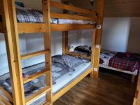 a couple of bunk beds in a room at La petite Anfiane in Le Grand-Bornand