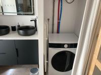 a kitchen with a washing machine and a sink at T2 Le Conquet &quot;Molène&quot; avec parking privé 300m commerces in Le Conquet