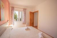 Postel nebo postele na pokoji v ubytování Villa Primavera V130 By MENORCARENTALS