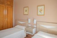 Postel nebo postele na pokoji v ubytování Villa Primavera V130 By MENORCARENTALS