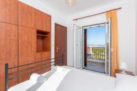 A bed or beds in a room at Villa Europe Thia