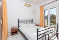 A bed or beds in a room at Villa Europe Thia
