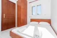 A bed or beds in a room at Villa Europe Thia